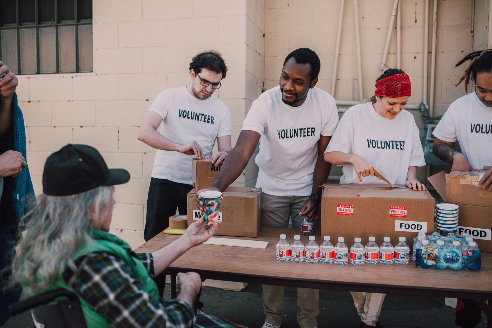 Volunteers handing out food and water