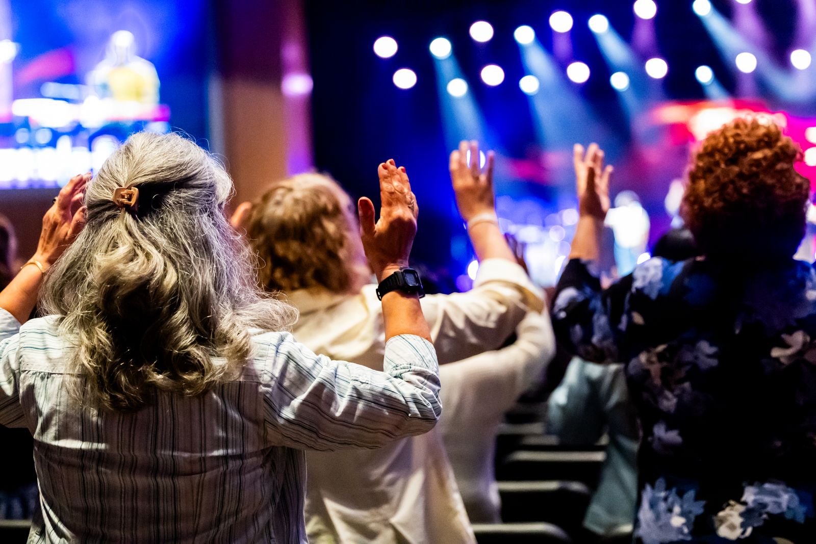 A congregation worshipping with raised hands